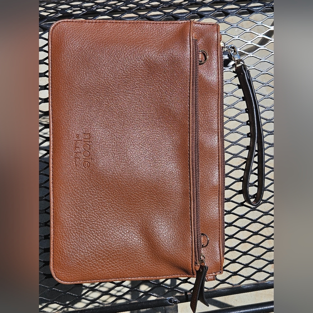 brown Nicole Miller wristlet, has marks inside as shown